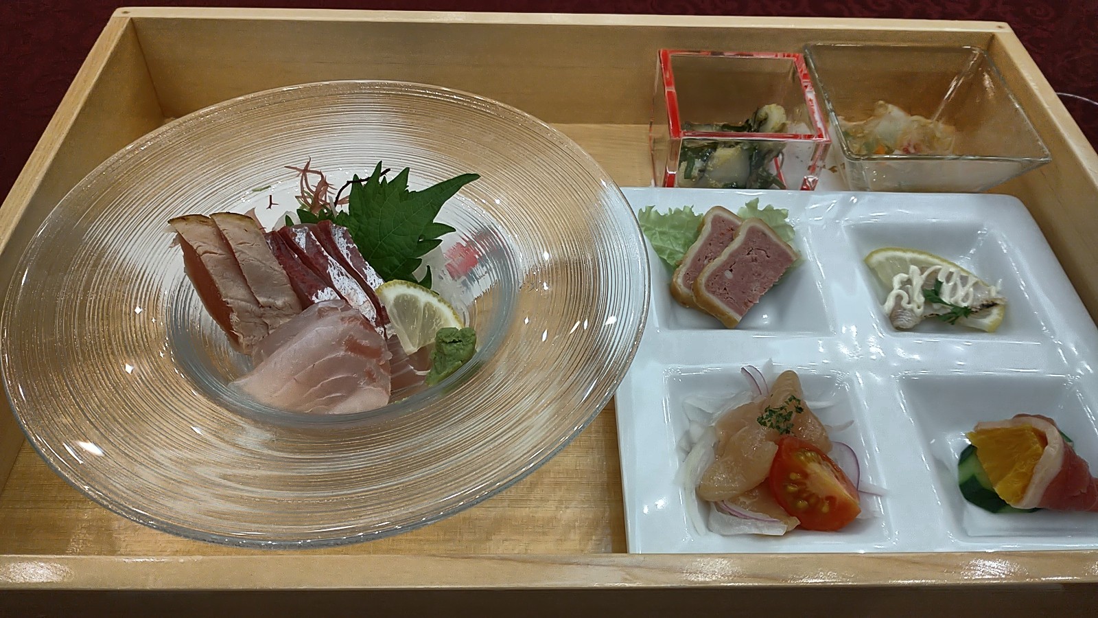 Fish sashimi with various Japanese side dishes