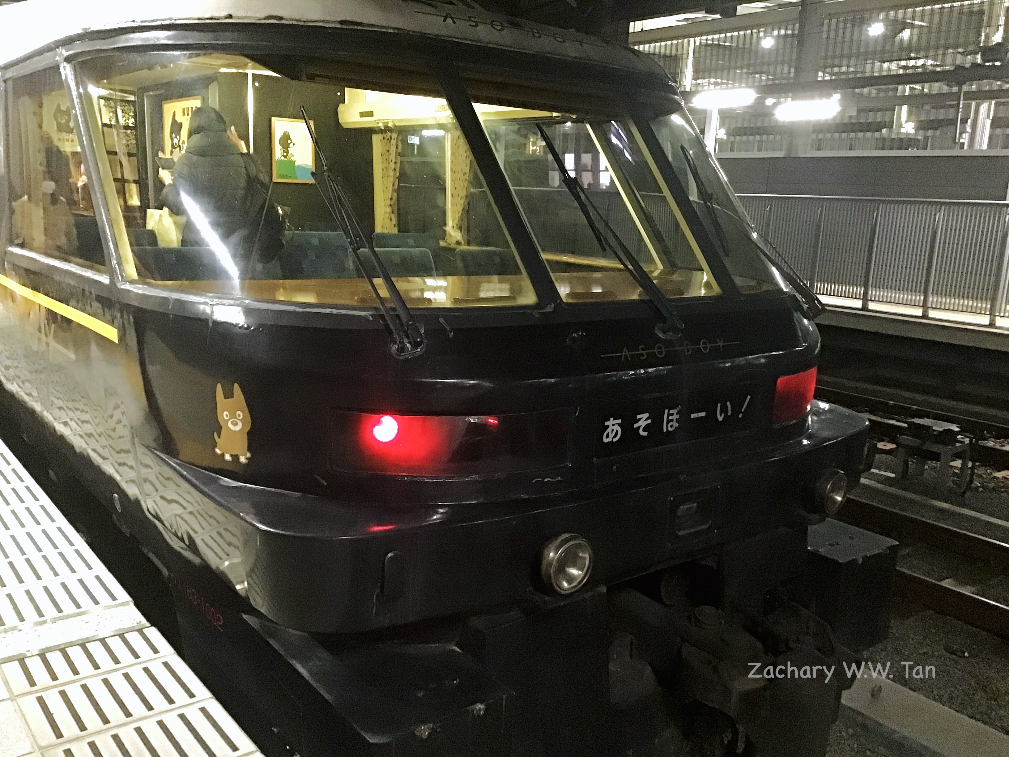 A train at rest by a station platform